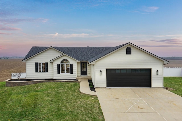 ranch-style house with fence, a shingled roof, a yard, concrete driveway, and an attached garage