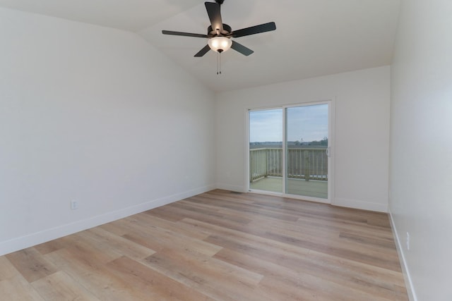 spare room with light wood finished floors, lofted ceiling, and a ceiling fan
