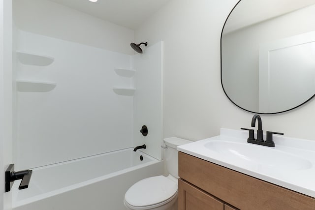 bathroom featuring toilet, vanity, and tub / shower combination