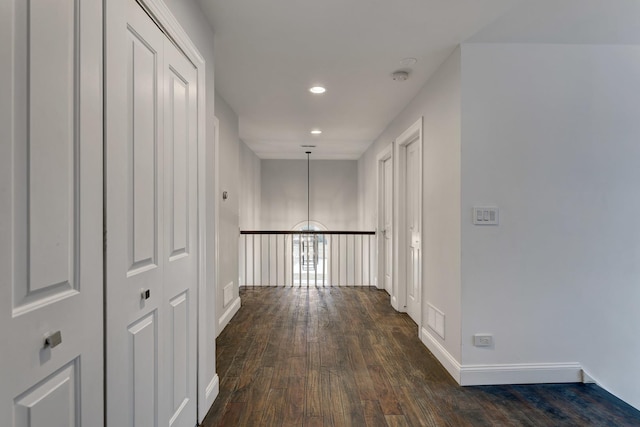 corridor featuring dark wood-type flooring