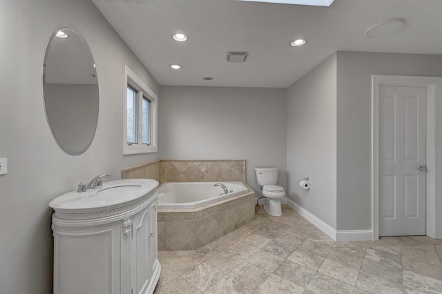 bathroom with a relaxing tiled tub and toilet