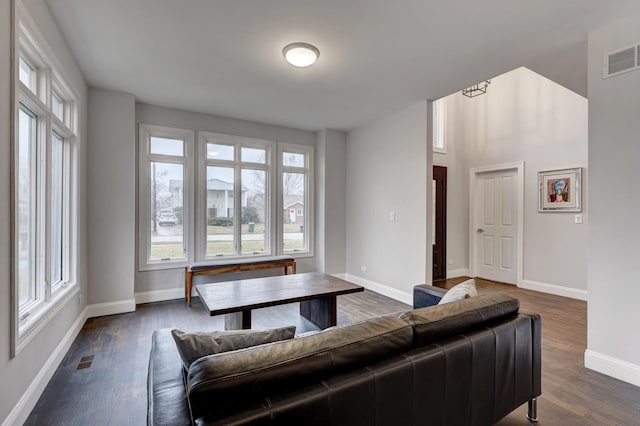 living room with dark hardwood / wood-style floors