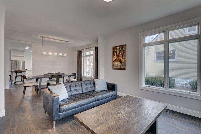 living room with dark hardwood / wood-style floors