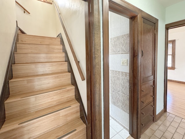 stairs with hardwood / wood-style flooring