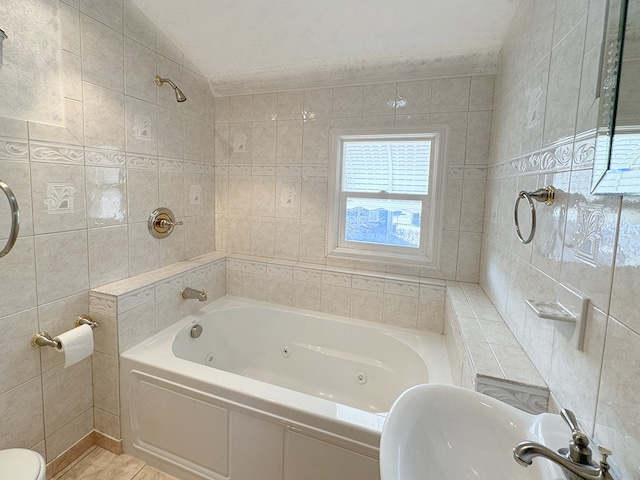 bathroom with shower / bath combination and tile walls