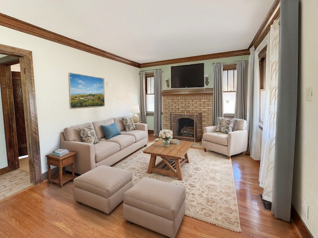 living room featuring ornamental molding, plenty of natural light, and hardwood / wood-style floors