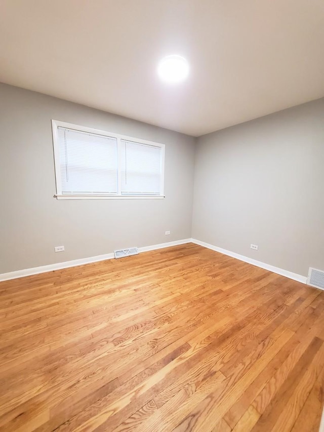 empty room with light wood-type flooring