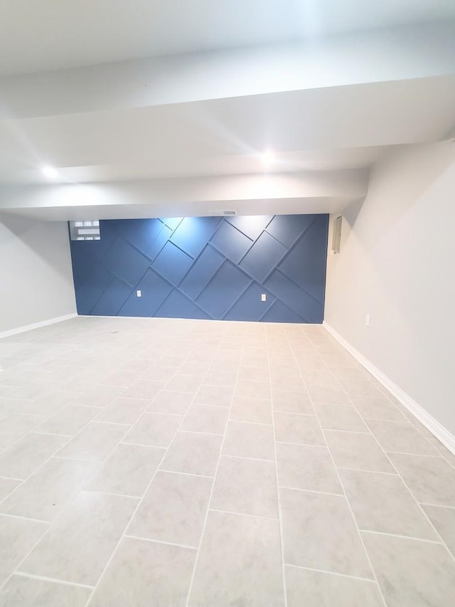 basement featuring light tile patterned floors