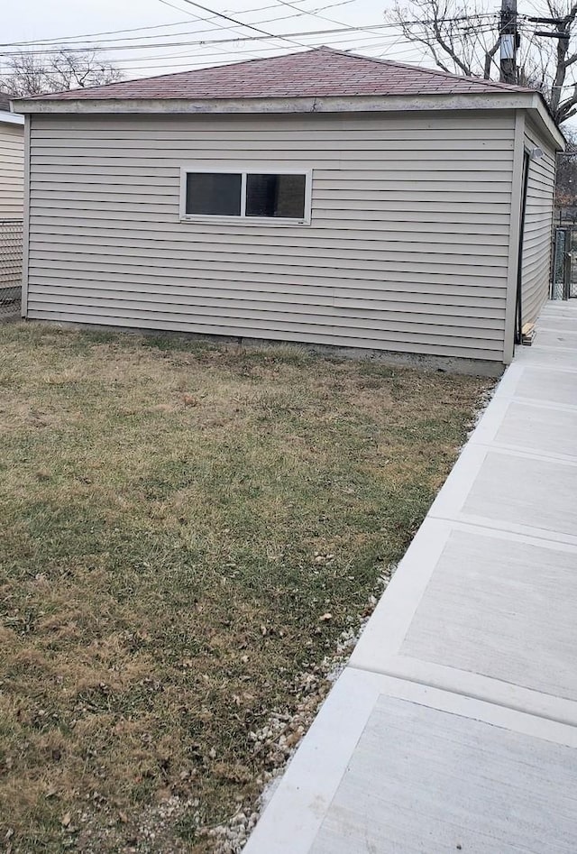 view of side of home featuring a yard