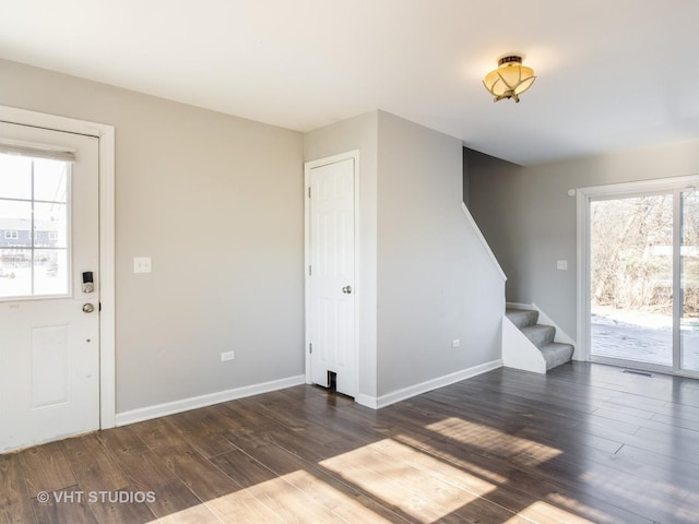 entrance foyer with dark hardwood / wood-style flooring