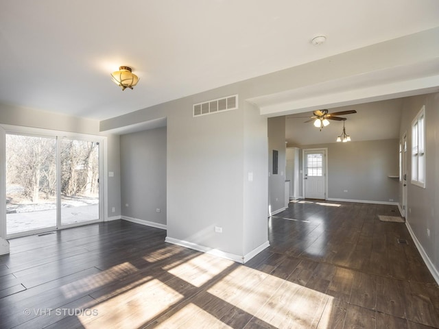 spare room with dark hardwood / wood-style flooring and ceiling fan