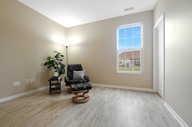 sitting room featuring light hardwood / wood-style flooring