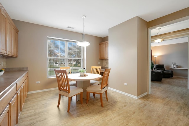 dining room with light hardwood / wood-style floors