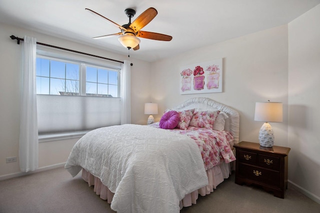 bedroom with light carpet, ceiling fan, and baseboards