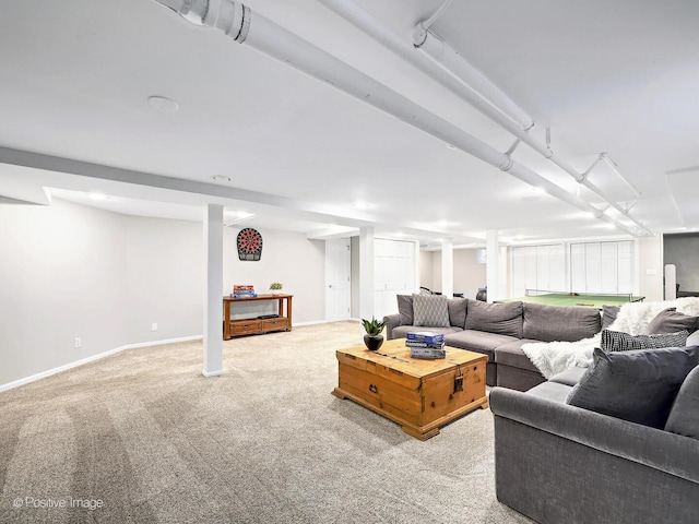 living room featuring light carpet and baseboards