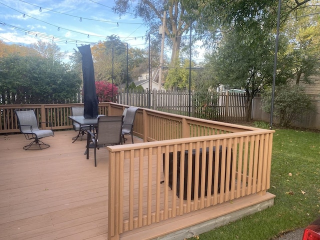 wooden deck with fence and outdoor dining space