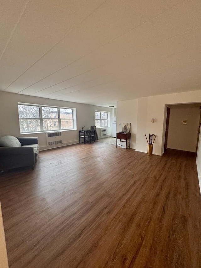 bonus room with dark wood-type flooring