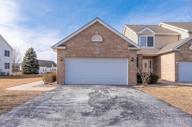 front of property with a garage