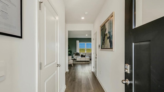 hallway featuring dark hardwood / wood-style flooring