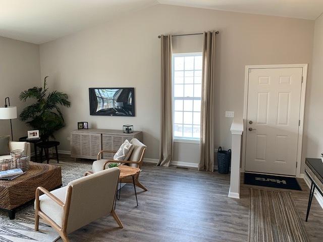 488 Ridge Ln, Bolingbrook, IL 60440 - living room with vaulted ceiling, hardwood / wood-style floors, and a wealth of natural light