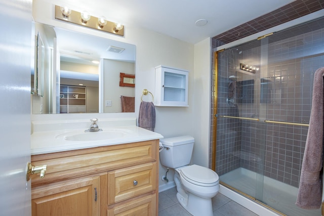 bathroom featuring walk in shower, tile patterned floors, toilet, and vanity