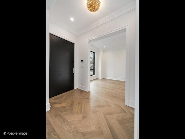 hall featuring crown molding and light parquet floors