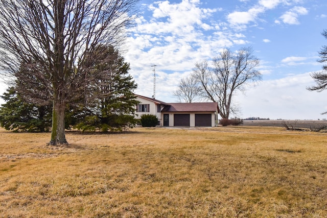 view of yard featuring an attached garage