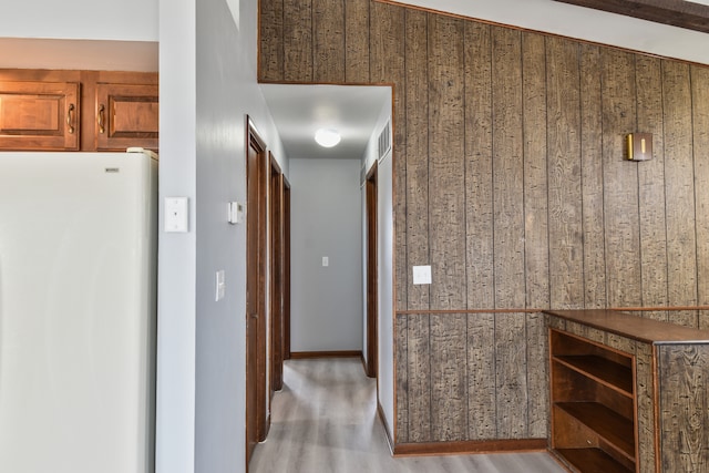 corridor with wood finished floors