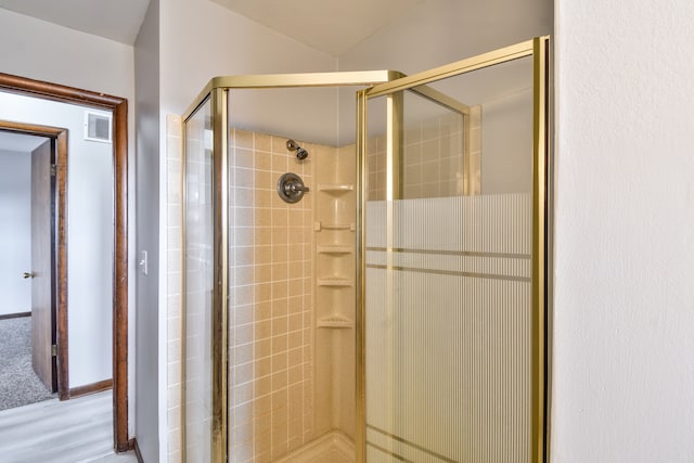 full bath featuring a shower stall and visible vents