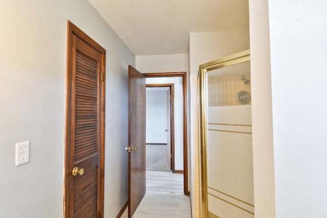 hallway featuring baseboards