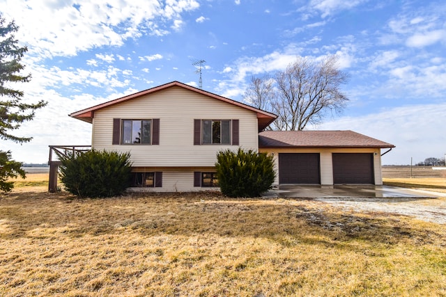 tri-level home with an attached garage and driveway