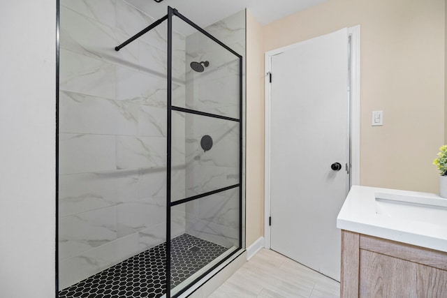 bathroom featuring vanity and a tile shower