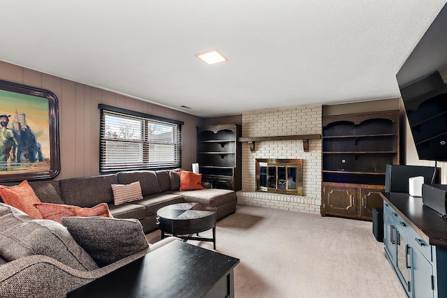 living room featuring light colored carpet and a fireplace