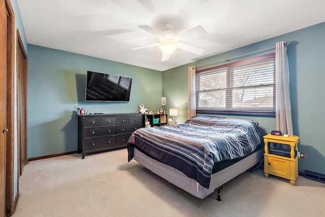 bedroom with light colored carpet and ceiling fan