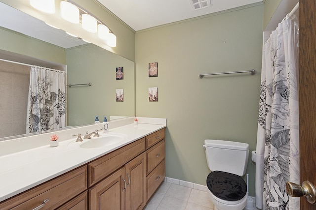 bathroom with tile patterned flooring, vanity, walk in shower, and toilet