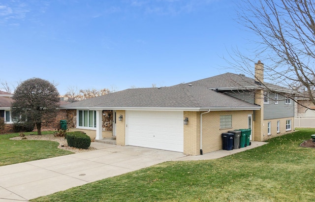 view of front facade with a garage and a front lawn