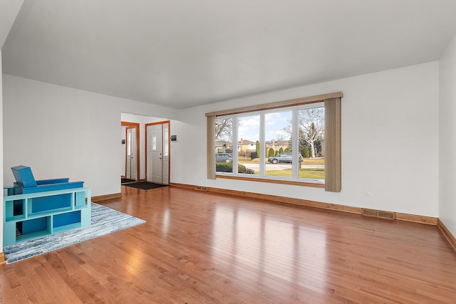 unfurnished living room featuring light wood-type flooring