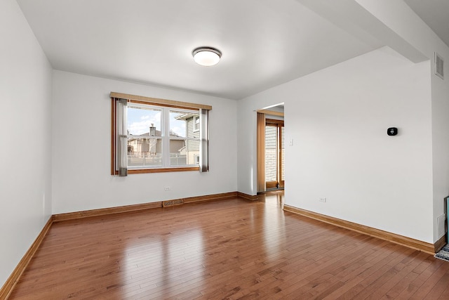 empty room featuring wood-type flooring