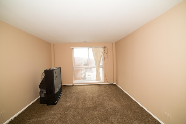 empty room with dark carpet