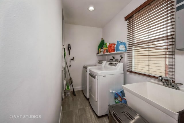 laundry area featuring washer and clothes dryer and sink