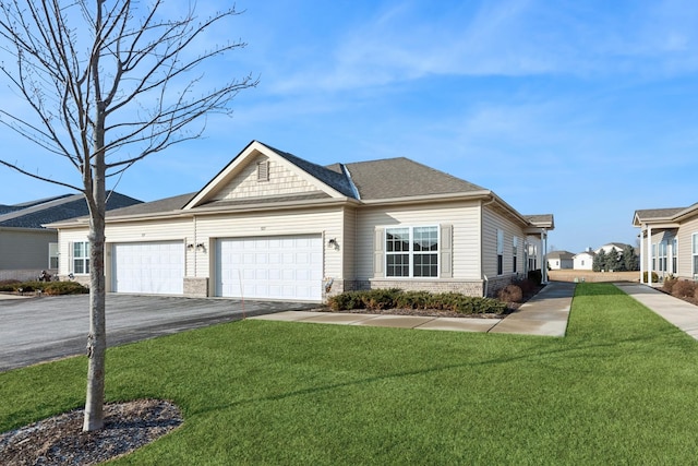 view of front of property featuring a garage and a front yard