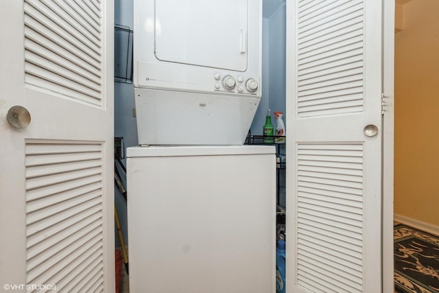 washroom with stacked washer and clothes dryer