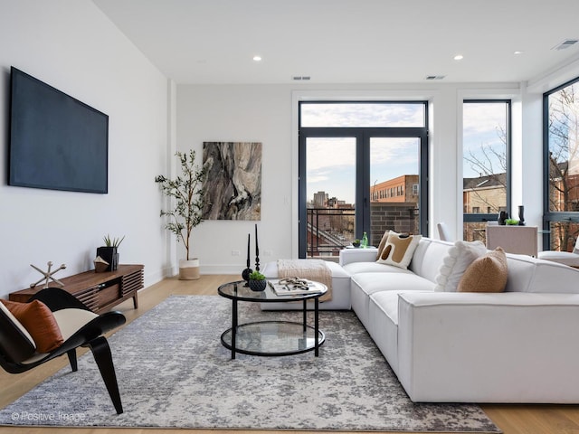 living room with light hardwood / wood-style flooring