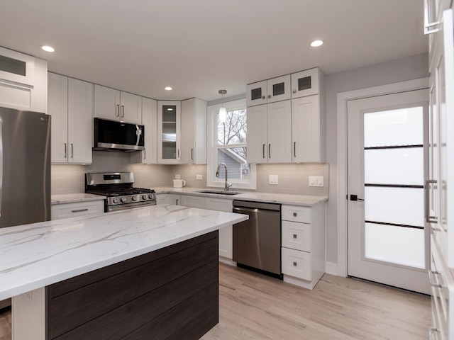 6310 Hilly Way, Cary, IL 60013 - kitchen featuring stainless steel appliances, white cabinets, backsplash, light wood-style floors, and recessed lighting