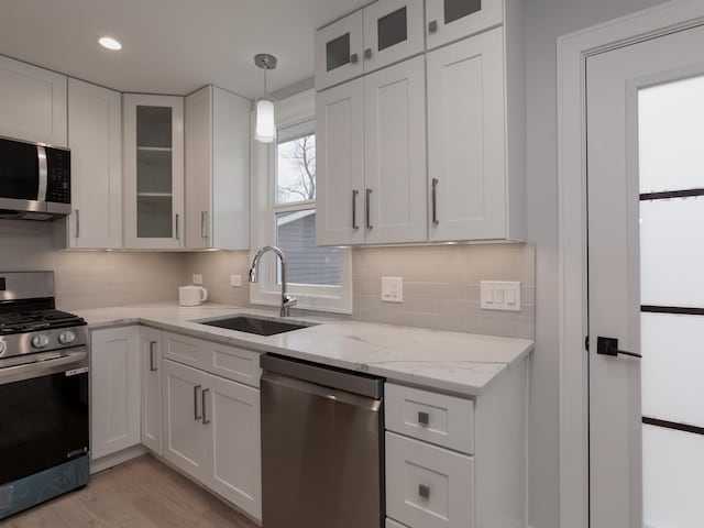6310 Hilly Way, Cary, IL 60013 - kitchen with stainless steel appliances, white cabinets, and tasteful backsplash