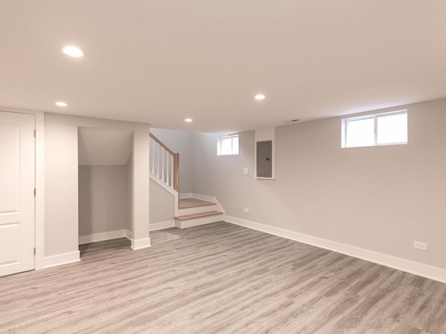 6310 Hilly Way, Cary, IL 60013 - basement featuring recessed lighting, light wood-type flooring, electric panel, and stairway