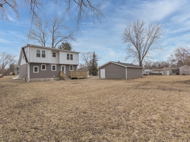 6310 Hilly Way, Cary, IL 60013 - rear view of property with board and batten siding, a wooden deck, an outbuilding, and a lawn