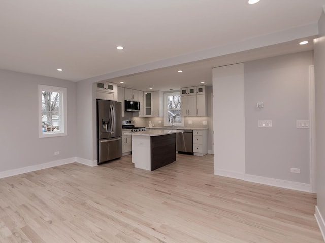 6310 Hilly Way, Cary, IL 60013 - kitchen featuring stainless steel appliances, recessed lighting, a kitchen island, light wood-style floors, and light countertops