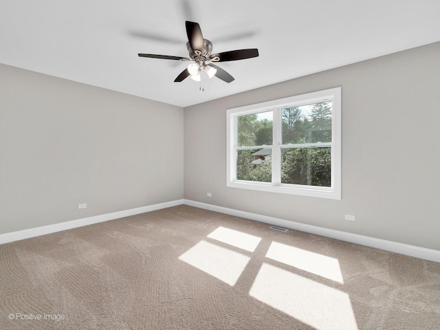 carpeted empty room with ceiling fan