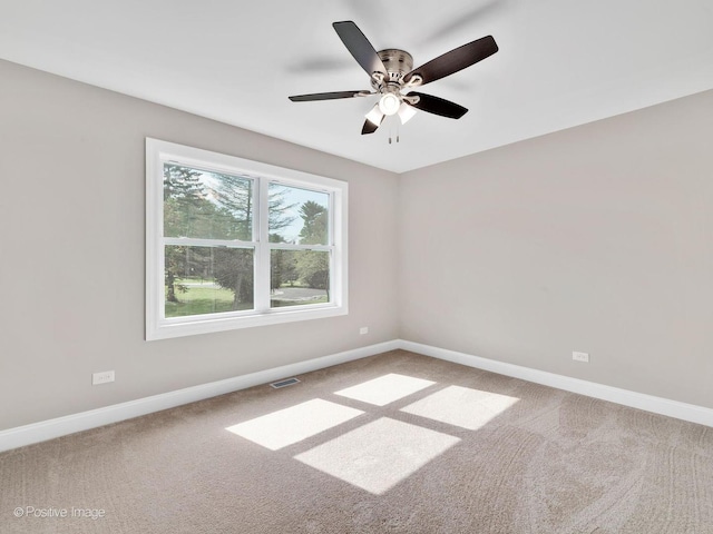 carpeted empty room with ceiling fan